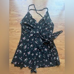 Free People romper, size 10. Black with pink floral excellent preowned condition